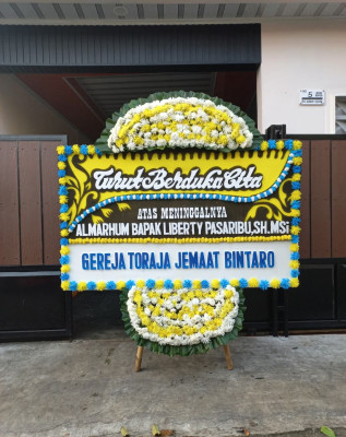Papan Bunga Duka di Muncung
